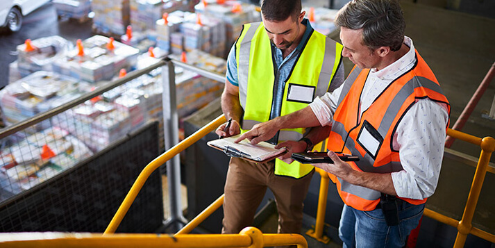 Employee in warehouse looking to report