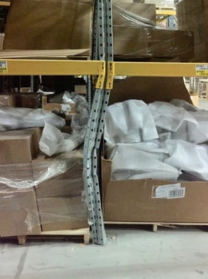 Damaged pallet rack upright column