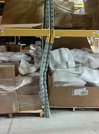 Damaged pallet rack upright column