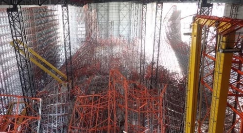 Critical load testing in a large automated warehouse resulted in a total rack failure, causing damage to both the structure and the building.