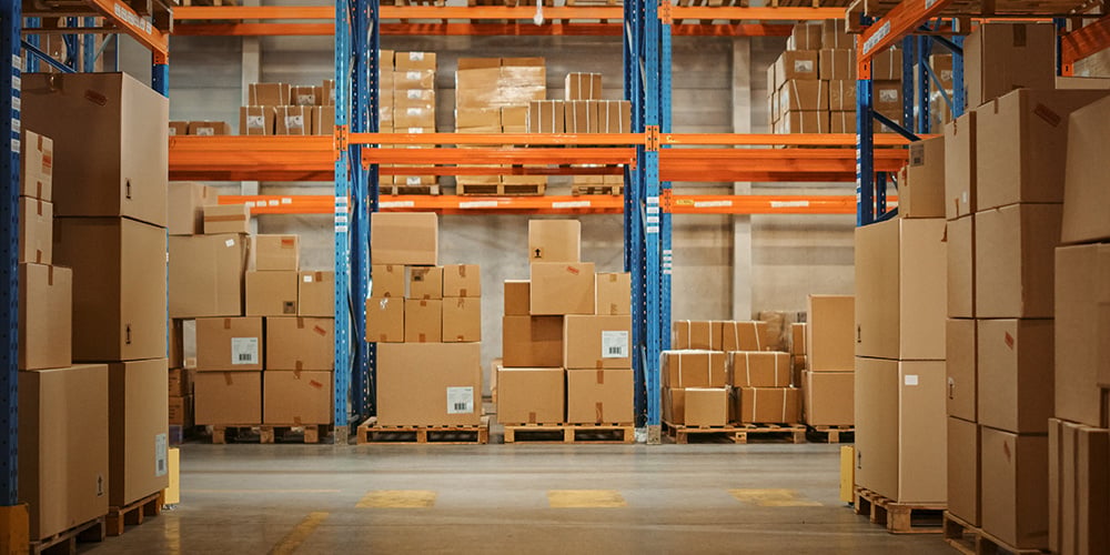 Pallet rack shims in a warehouse