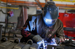 Damotech welder working on industry's best engineered rack repair kit: DAMO PRO