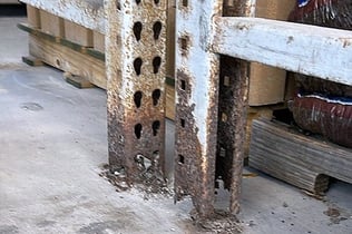 Corroded pallet rack column