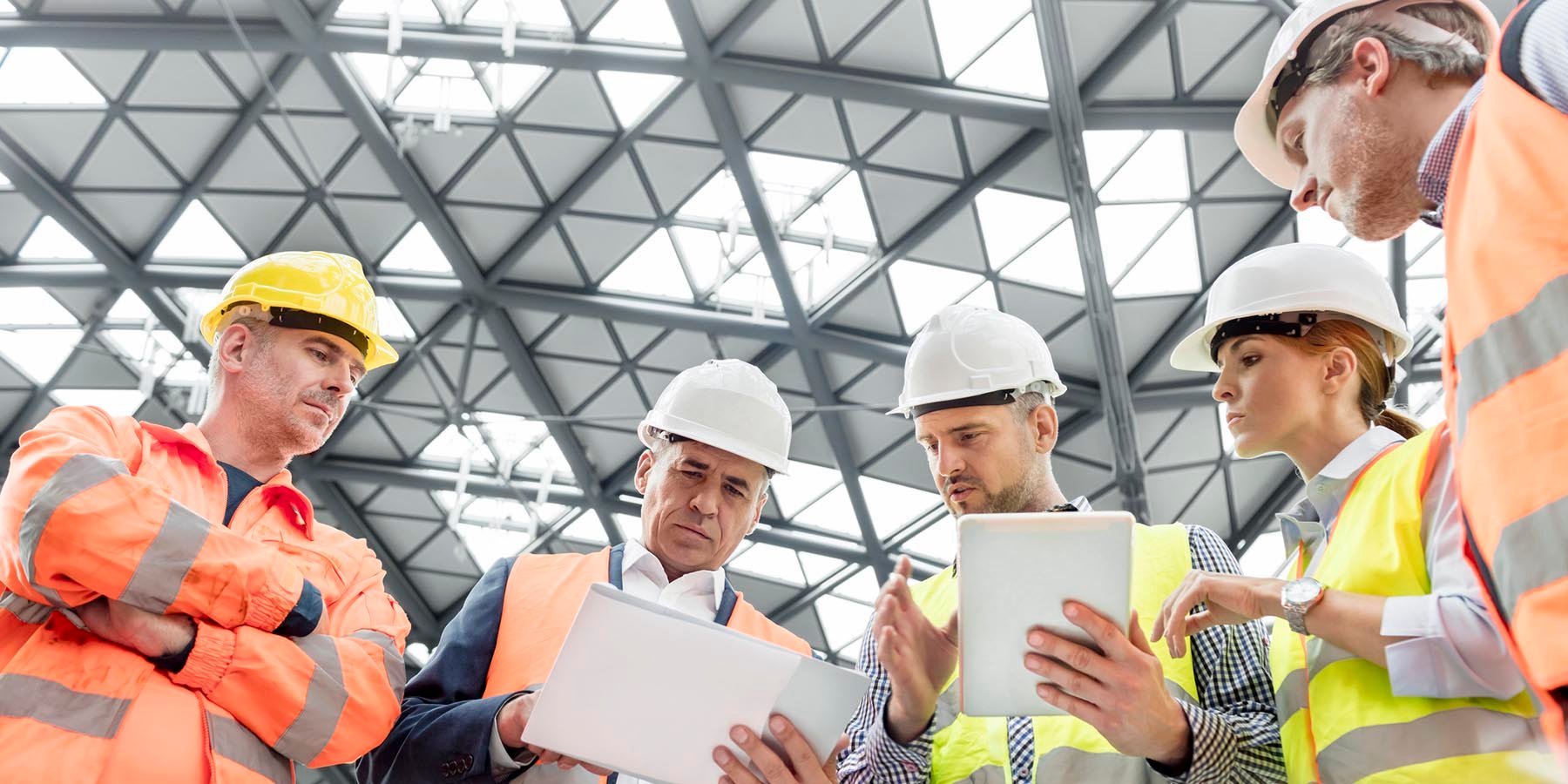 Rack safety experts discussing in a warehouse