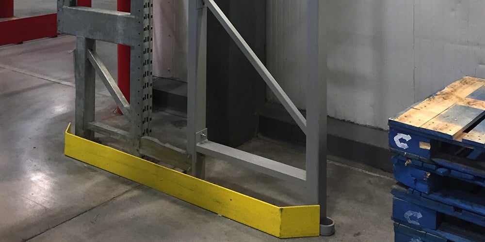 End of row guard installed in a warehouse