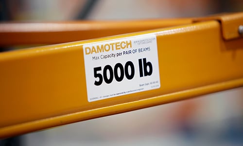 Damotech pallet rack load capacity label on upright