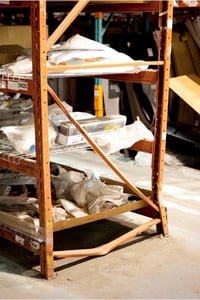 Deformed horizontal brace at aisle end