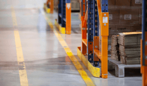 DAMO END GUARD protecting the end-of-aisle frame of a pallet rack