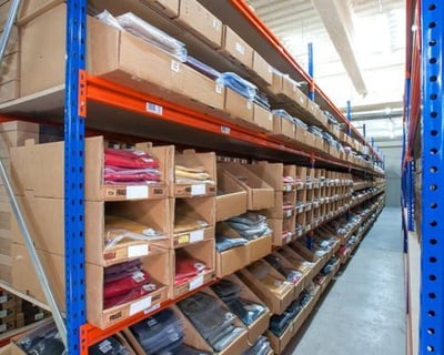 Folded clothing stored in high-density pallet racks