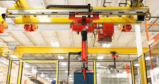 Electric chain hoist installed for warehouse lifting