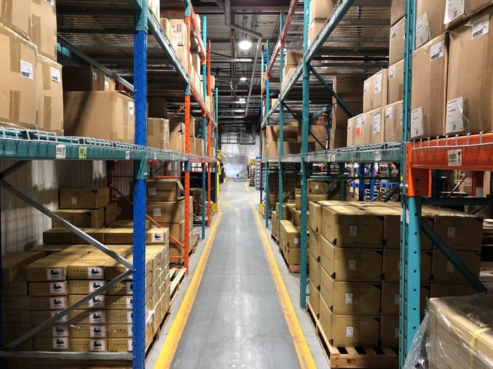 Warehouse racking systems with a combination of components from different manufacturers