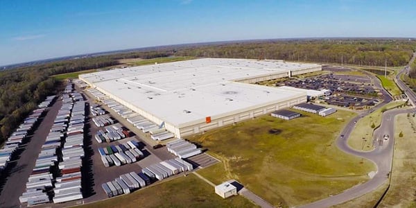 Aerial view of Nike’s North America Logistics Campus in Memphis, Tennessee, showing the expansive distribution center with adjacent truck bays and support buildings.