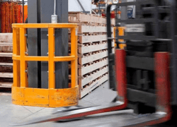 Orange DAMO SHIELD Guard protecting a column in a manufacturing facility
