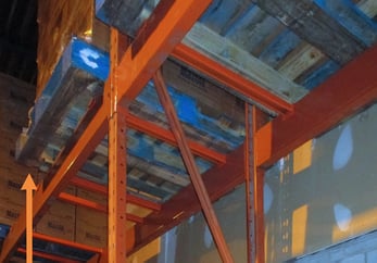 Overhang pallet on tall rack beam