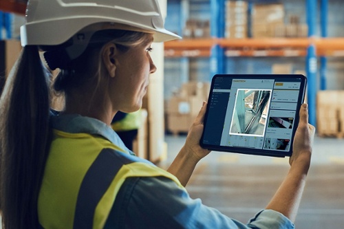 Damotech Platform shown on a tablet to track issues, trends, and ROI across sites in one dashboard.