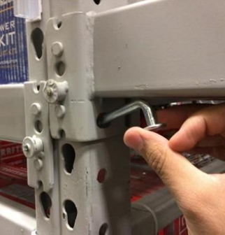 Safety pin installation on pallet racks