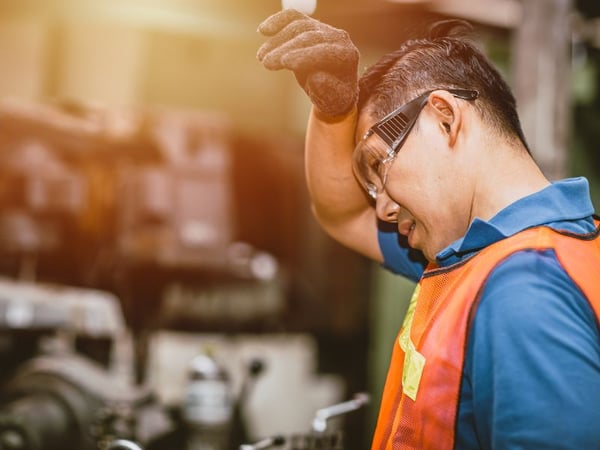 Dehydrated and exhausted warehouse associate resting during shift