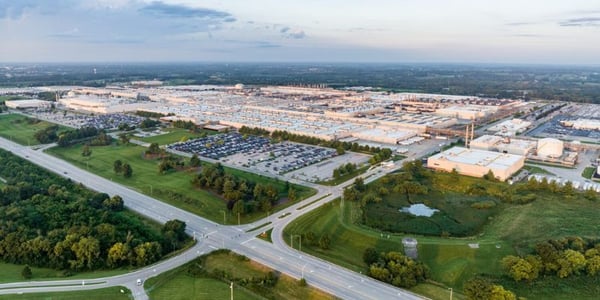 Aerial view of Toyota’s 9-million-square-foot manufacturing plant in Georgetown, Kentucky, showing expansive factory buildings, road networks, and green surroundings.