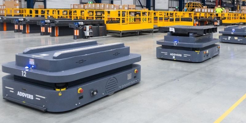 Autonomous mobile robots navigating warehouse aisles