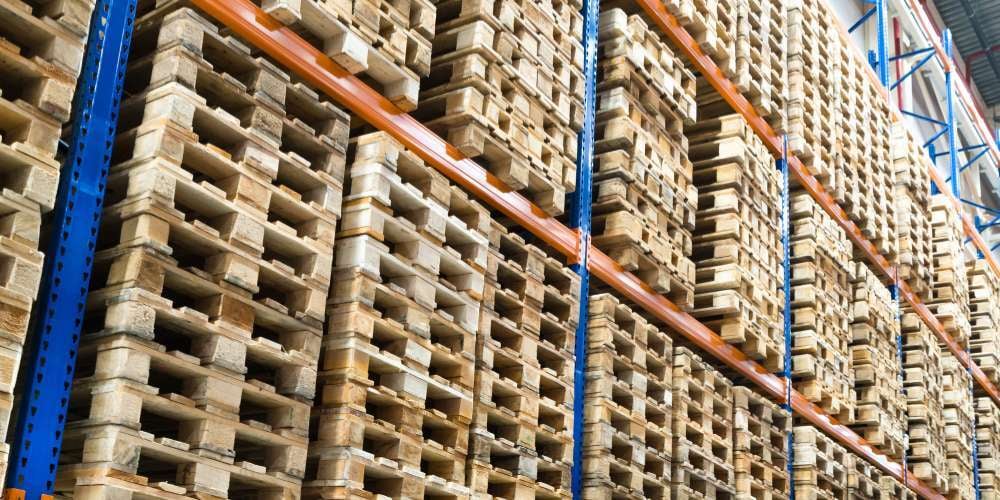 Wood pallets stacked in a warehouse