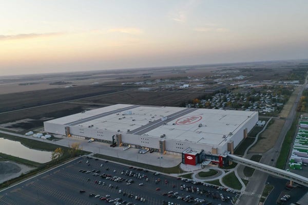 Exterior view of Digi-Key’s expanded distribution center in Thief River Falls, Minnesota, showing the massive multi-level facility with connected buildings and surrounding infrastructure.