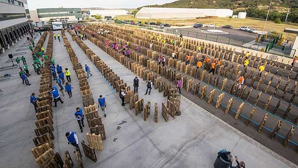 Most warehouse pallets toppled in domino fashion, a new Guinness World Record