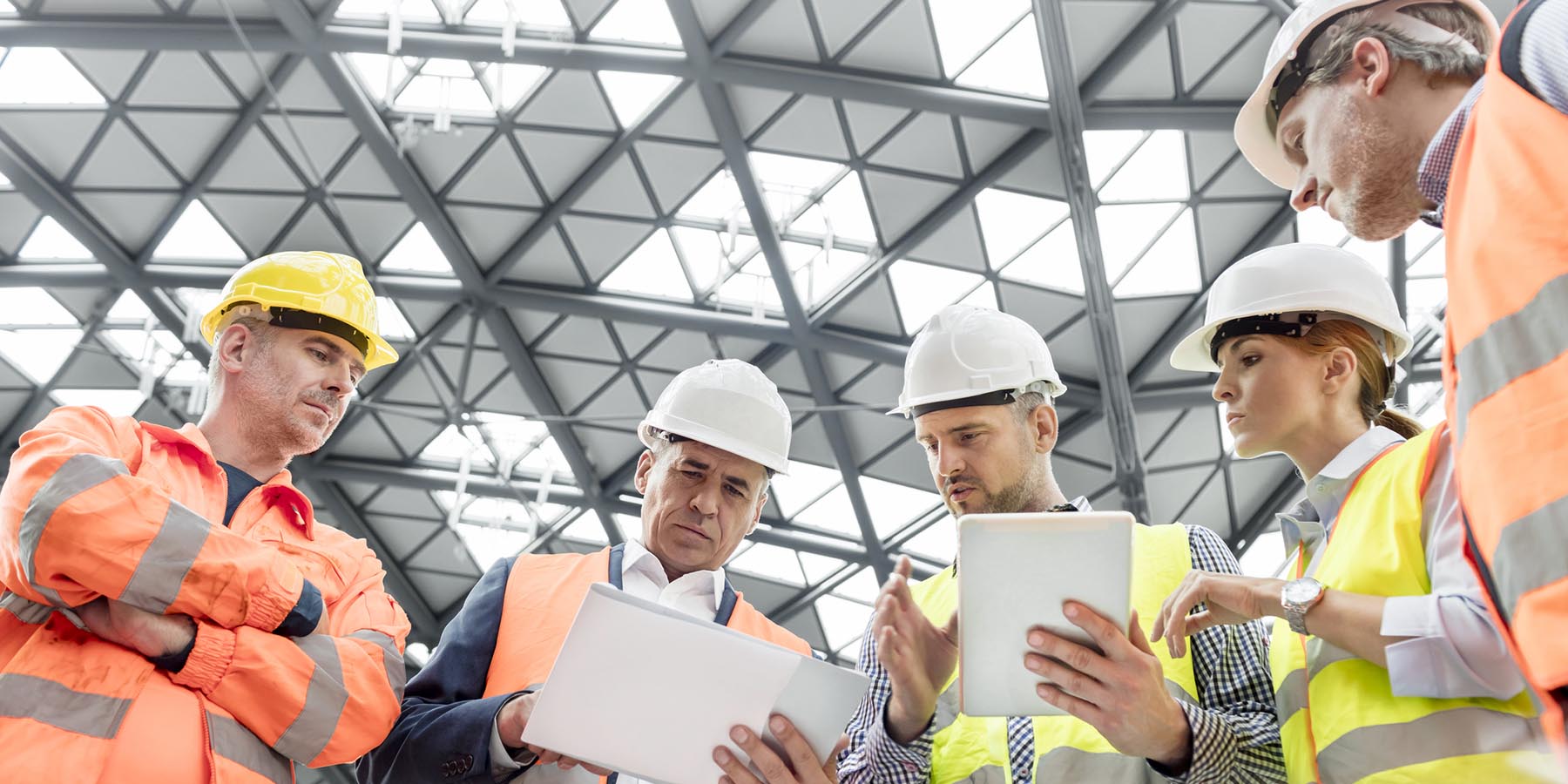 ack safety experts discussing in a warehouse