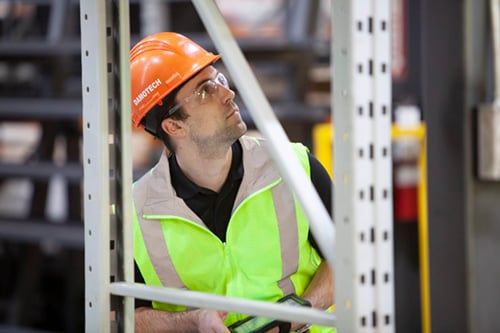 Damotech inspector doing a rack safety inspection