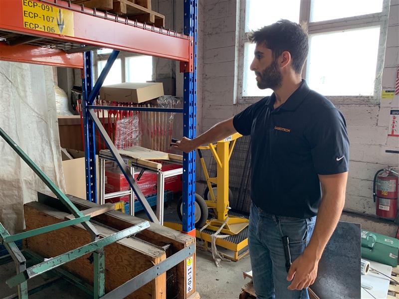 Engineer/Inspector Jean-Paul Khalil inspecting a rack in a warehouse