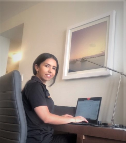 Damotech Engineer Soukayna El Hammouli working on an engineering report from her hotel room