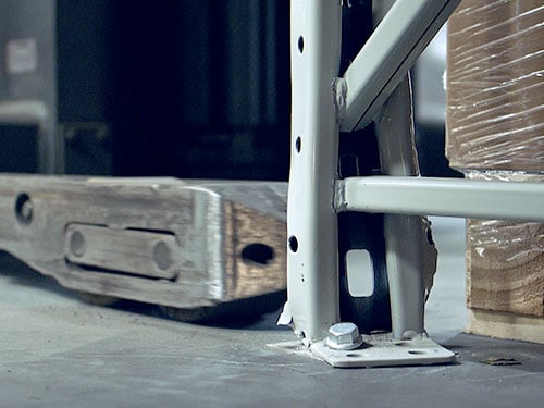 Forklift hitting a pallet rack